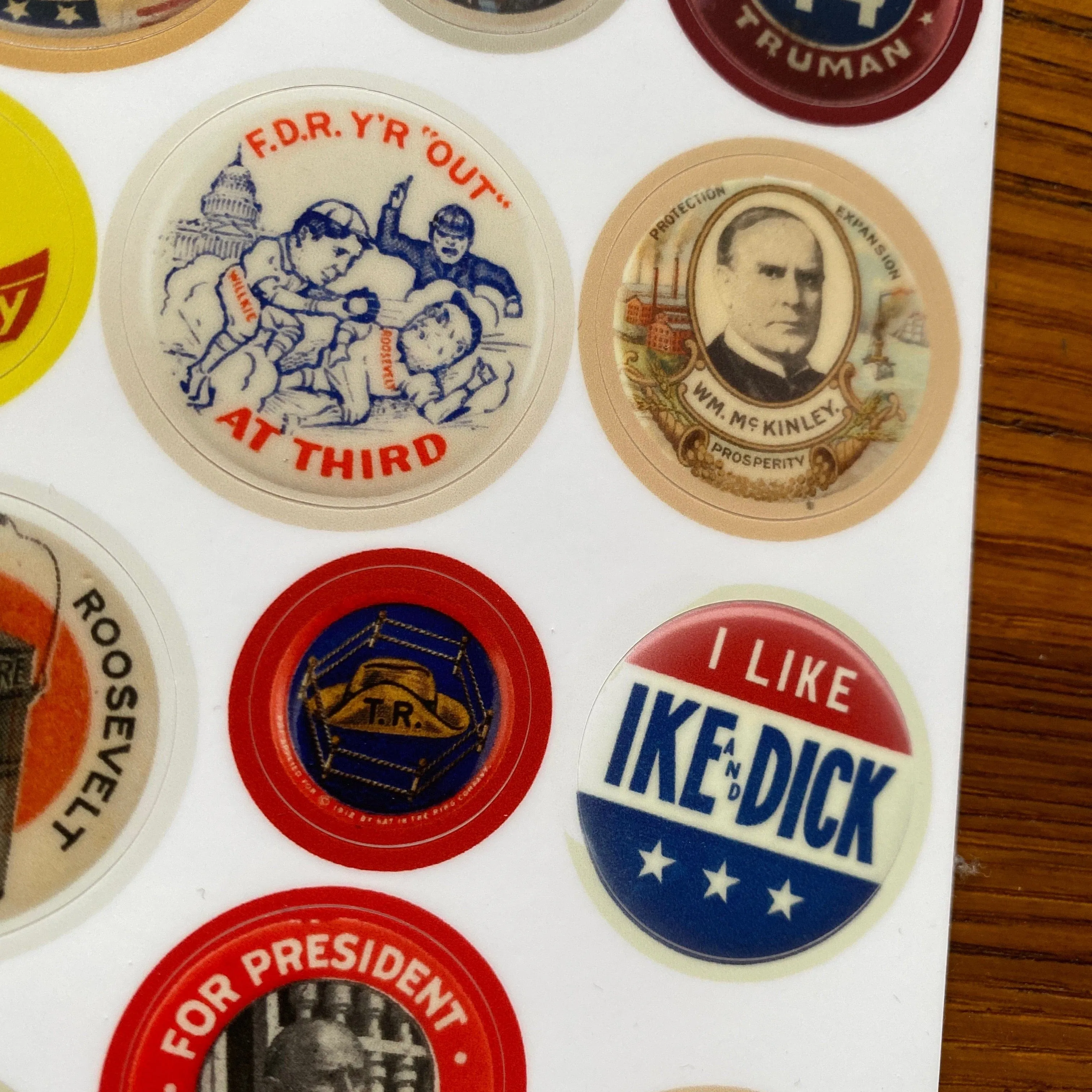 Historical presidential campaign button sticker sheet with images of 12 buttons